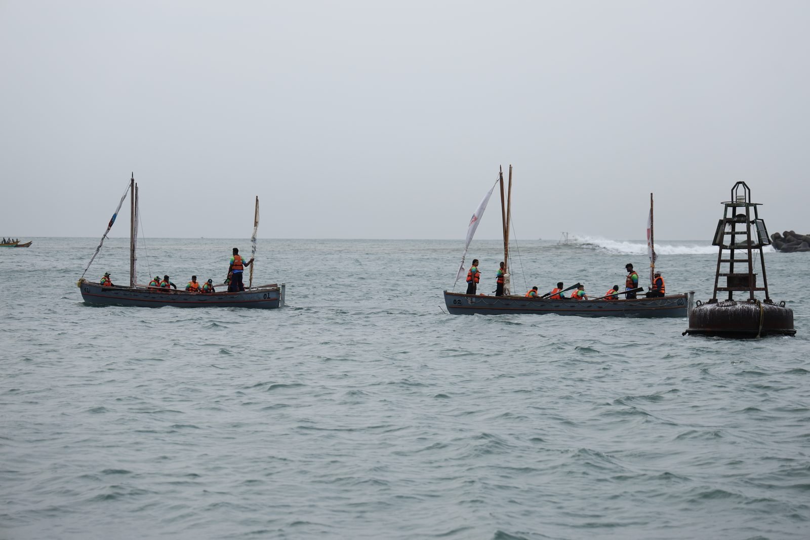 NCC whalers passing a channel-marker buoy near Chennai