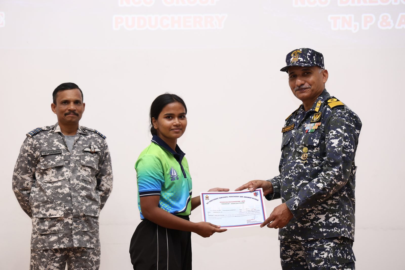 Woman cadet receiving her certificate at the closing ceremony