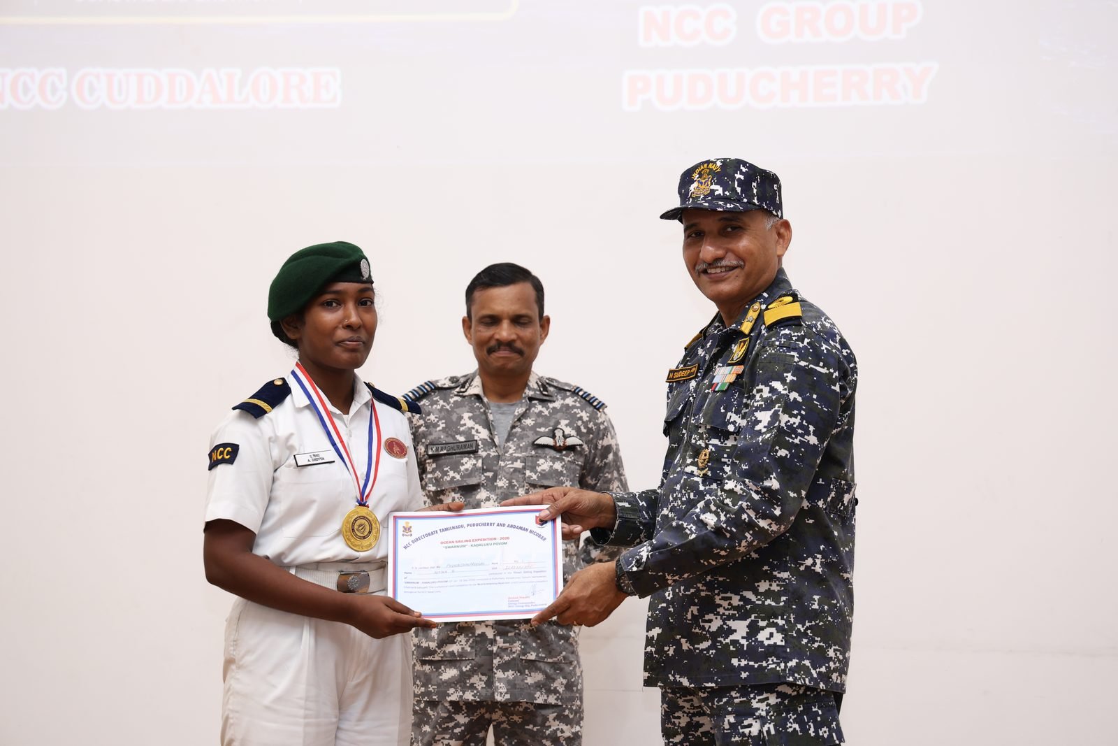Decorated cadet receiving a certificate at the closing ceremony