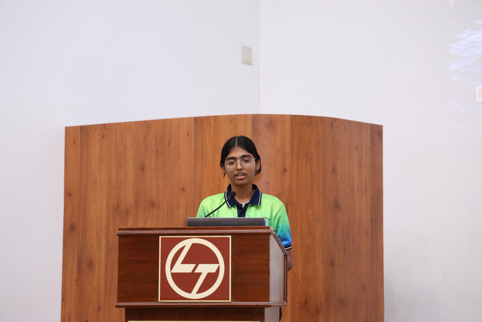 Woman cadet speaking at the closing-ceremony podium