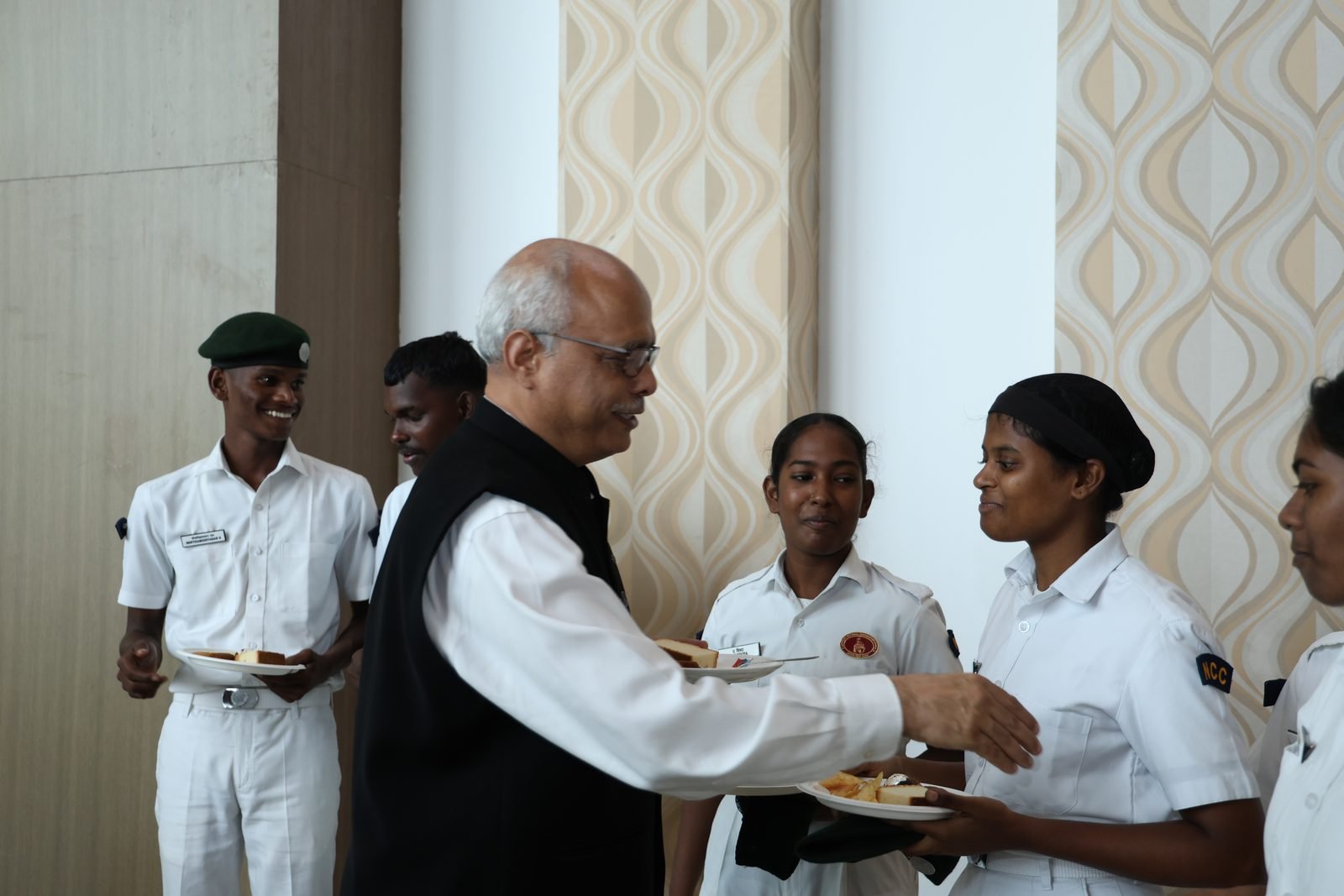 Chief guest greeting cadets during the reception