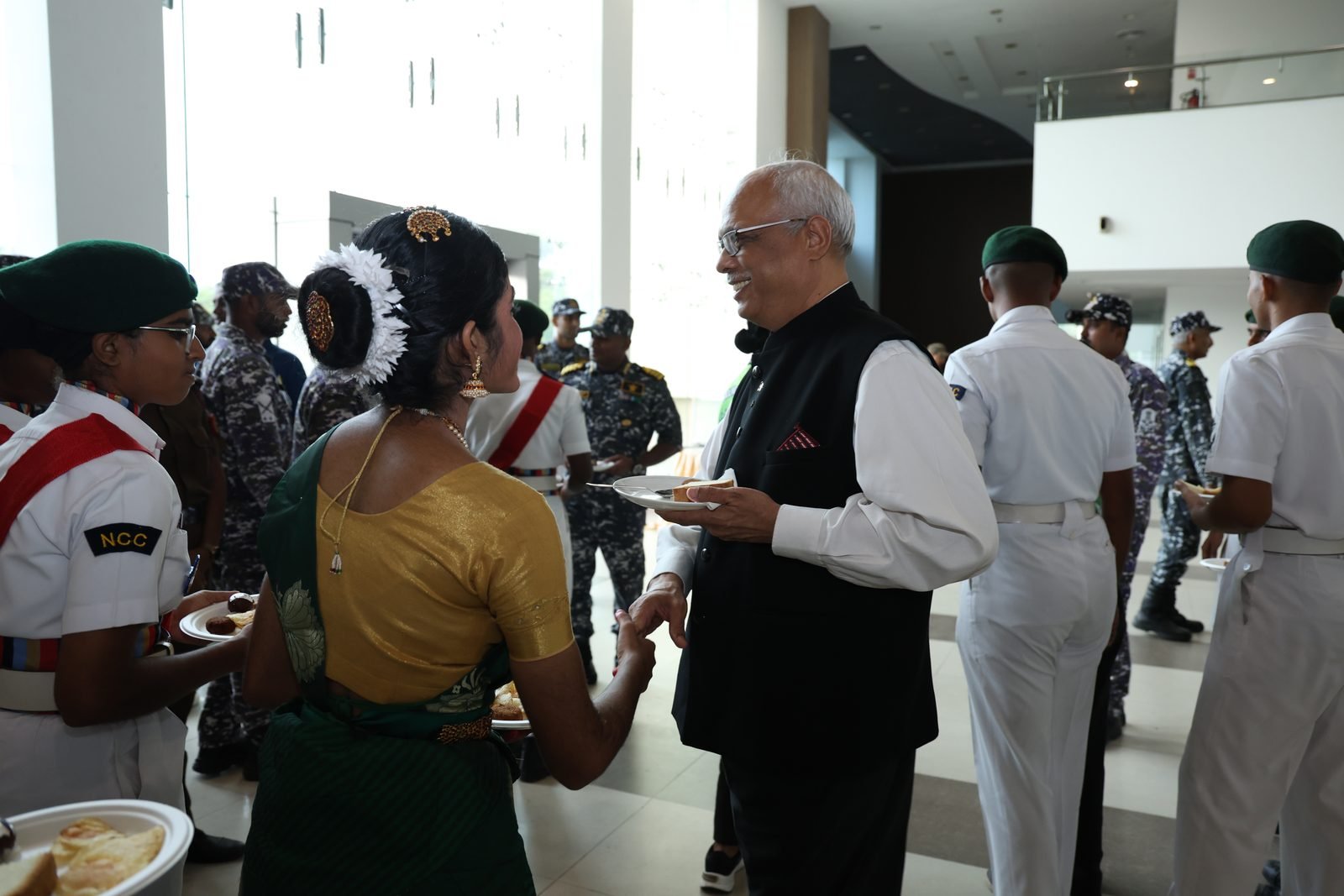 Dignitaries interacting with cadets at the reception