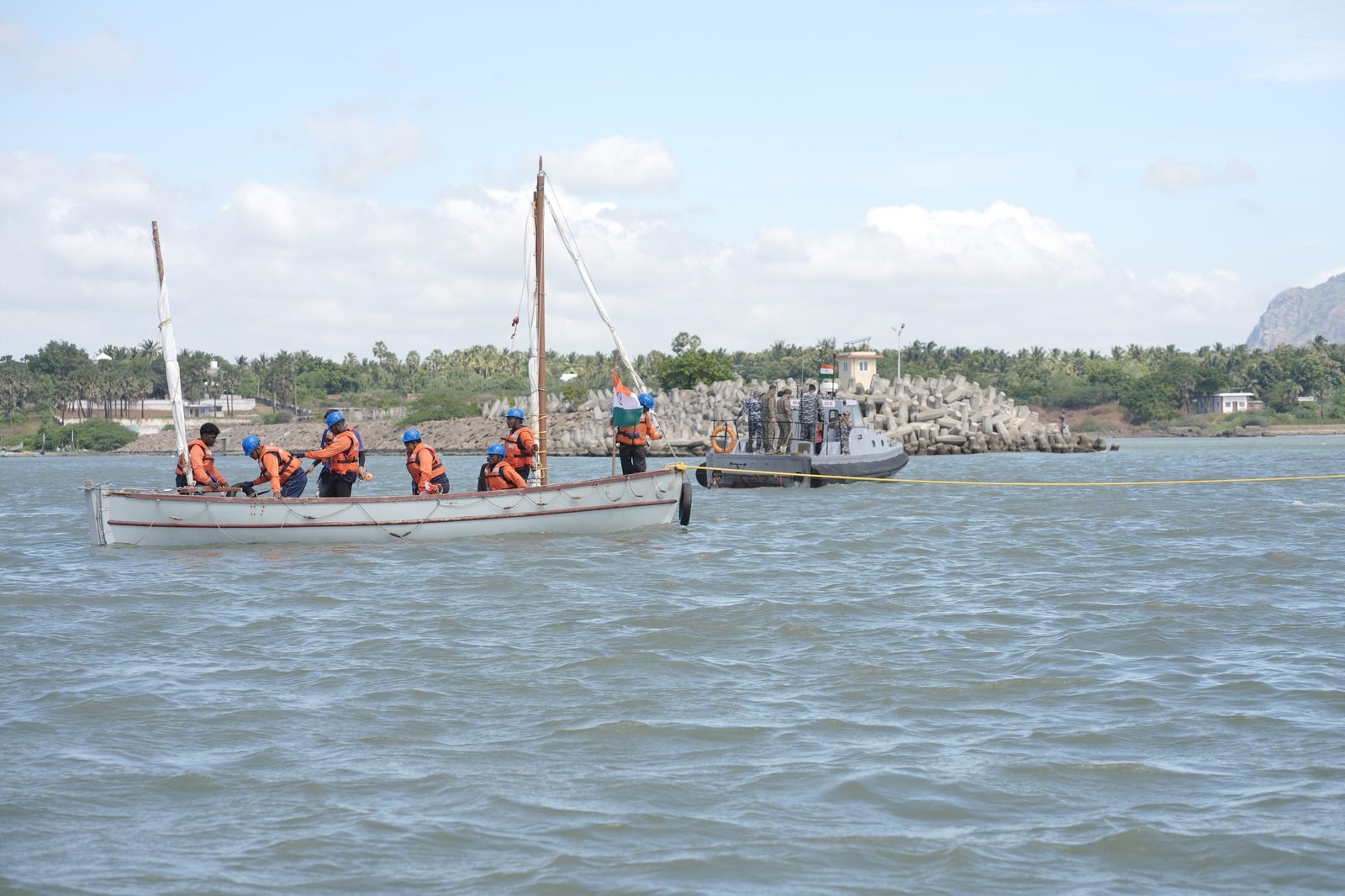NCC cadets sailing whaler near the Kanyakumari breakwater with Coast Guard escort
