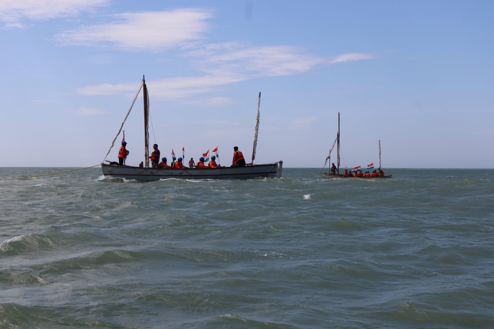 Two NCC whalers sailing with Indian tricolours in open sea