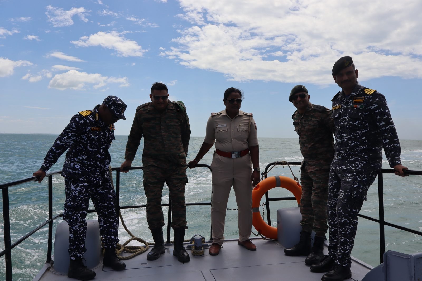Officers on the deck of the Indian Coast Guard boat