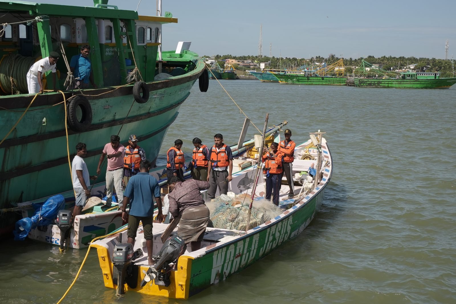 Rowing crew pulling in rhythm towards the shore