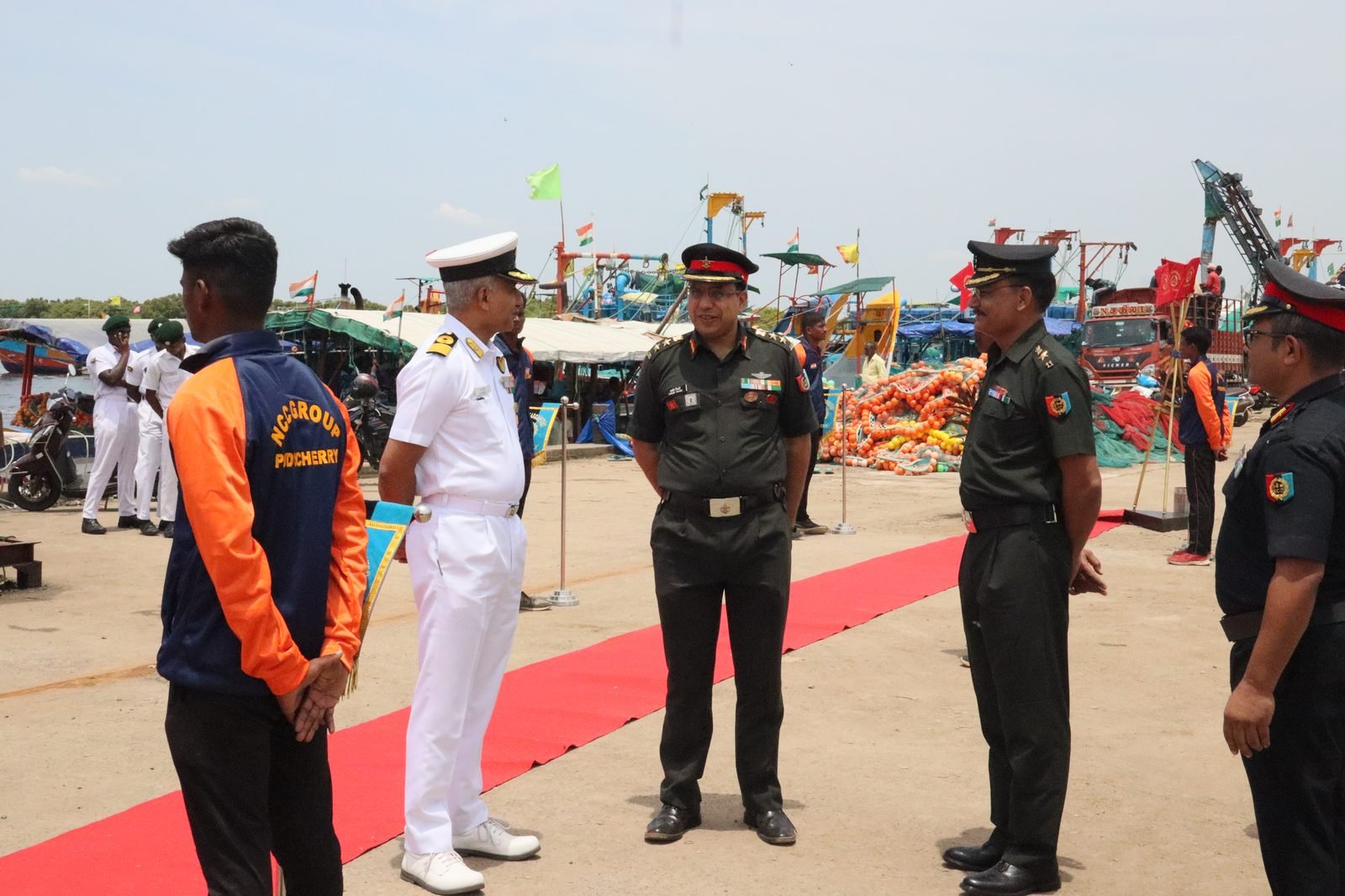 Officers on the red carpet with NCC cadets at harbour