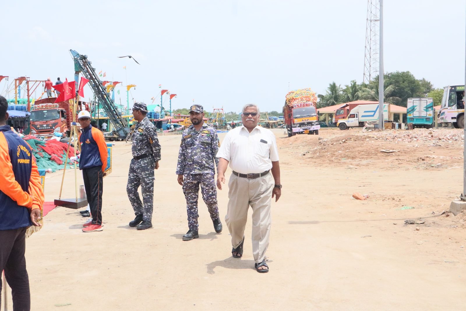 Dignitaries arriving at the ceremony area near the pier