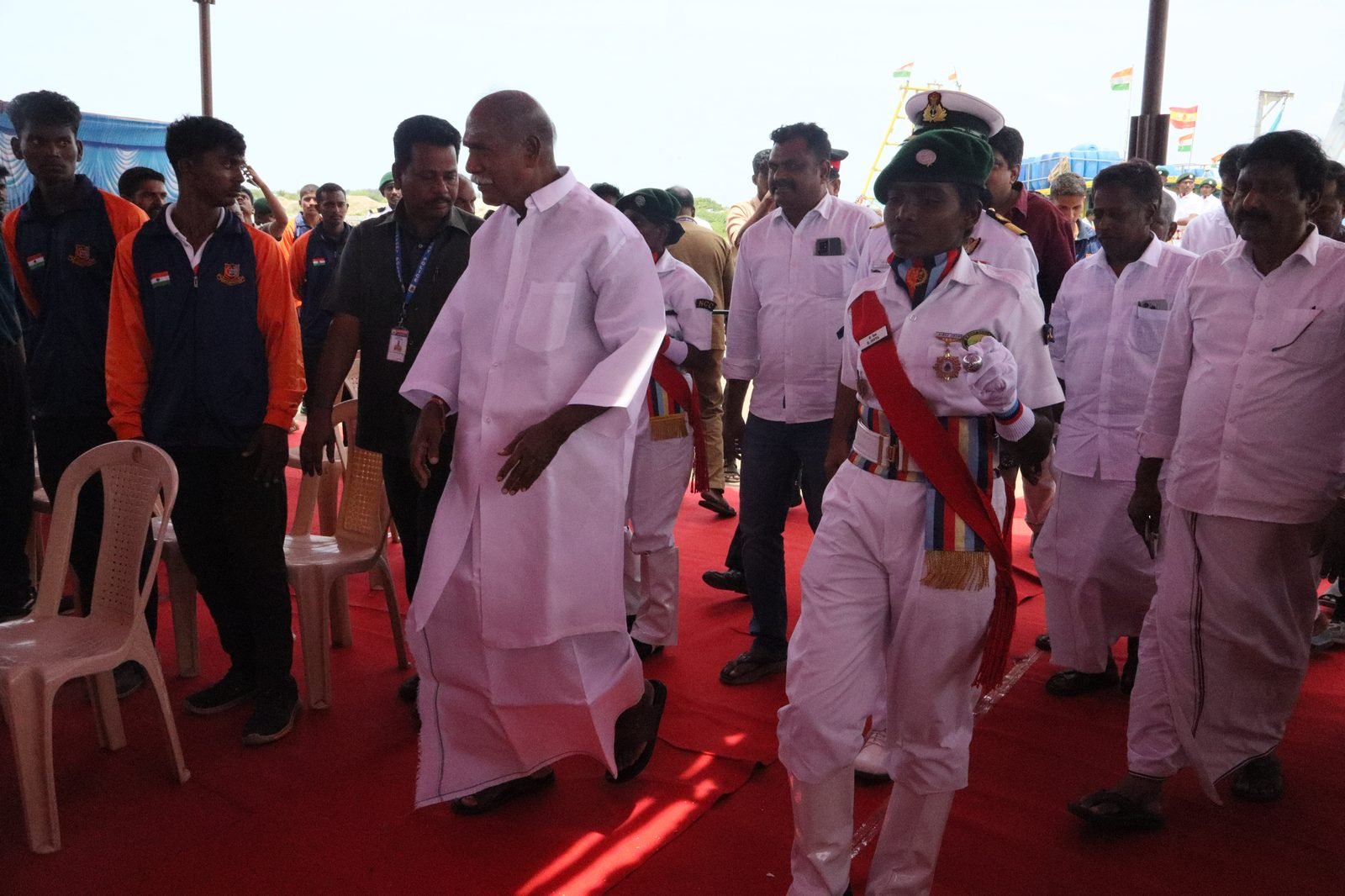 Guard presenting arms as dignitaries walk past