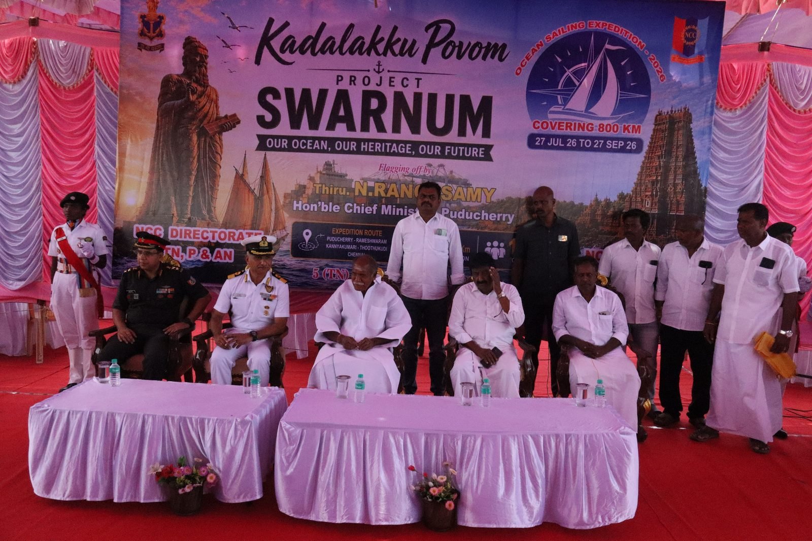 Dignitaries seated under the Kadalakku Povom Project SWARNUM banner