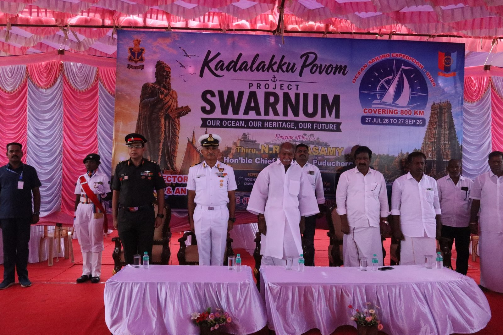 Stage view with dignitaries and officers at the flag-off ceremony