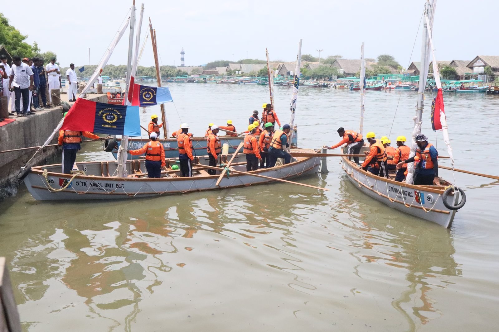 Boats departing from the Puducherry pier into open water
