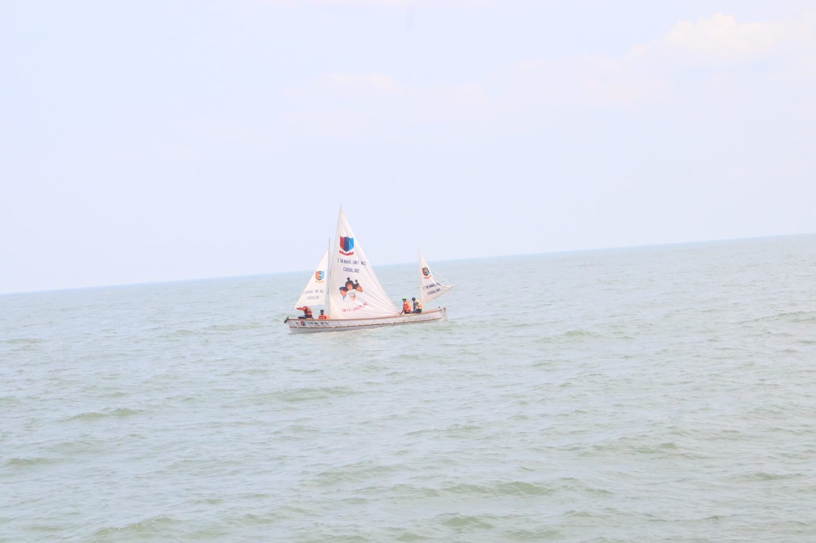 NCC cadets rowing in formation at sea